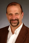 John Meyer, brown hair, brown eyes and goatee, in sport jacket and white button down shirt.